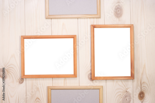 Mock up empty wood frames on light pine wood wall background, show text or product.
