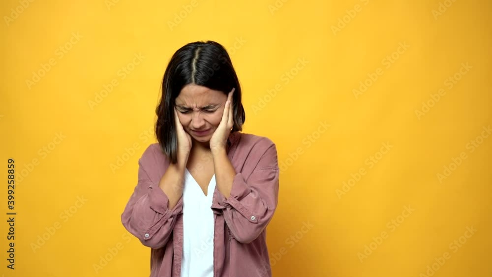 woman covering both ears with hands. Frustrated expression woman covering both ears with hands. Frustrated expression