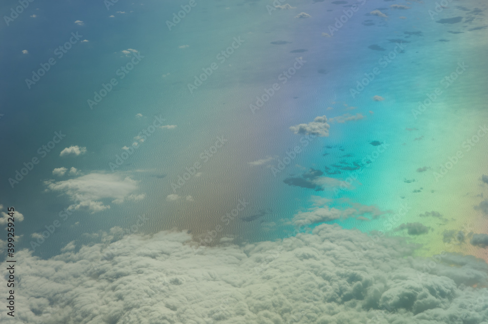 Fototapeta premium Aerial view of the Tyrrhenian sea. Colors produced when light is passed through the airplane window.