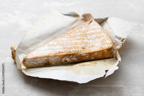 Canvas Print tainted cheese on ceramic background