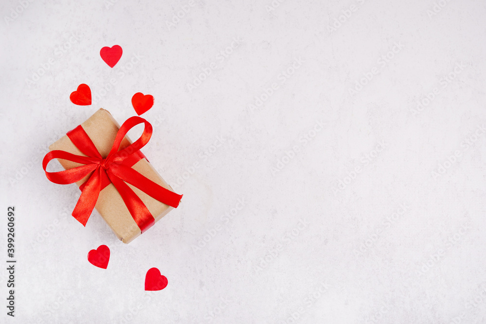 paper gift box with red bow and hearts on white background, copy space paper gift box with red bow and hearts on white background, copy space