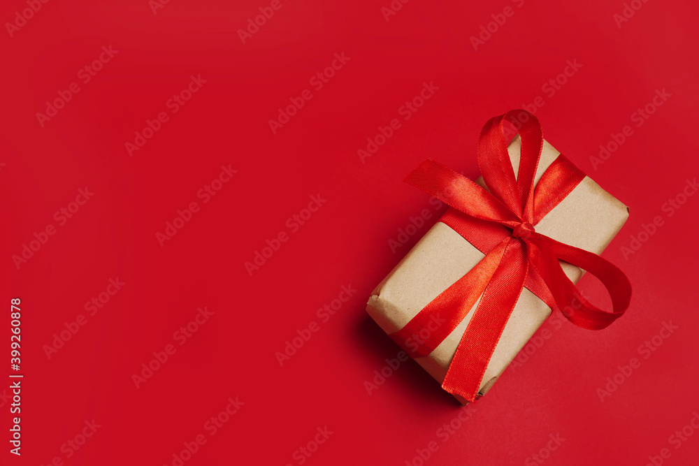 paper gift with red bow on red background. Free space for your text. paper gift with red bow on red background. Free space for your text.
