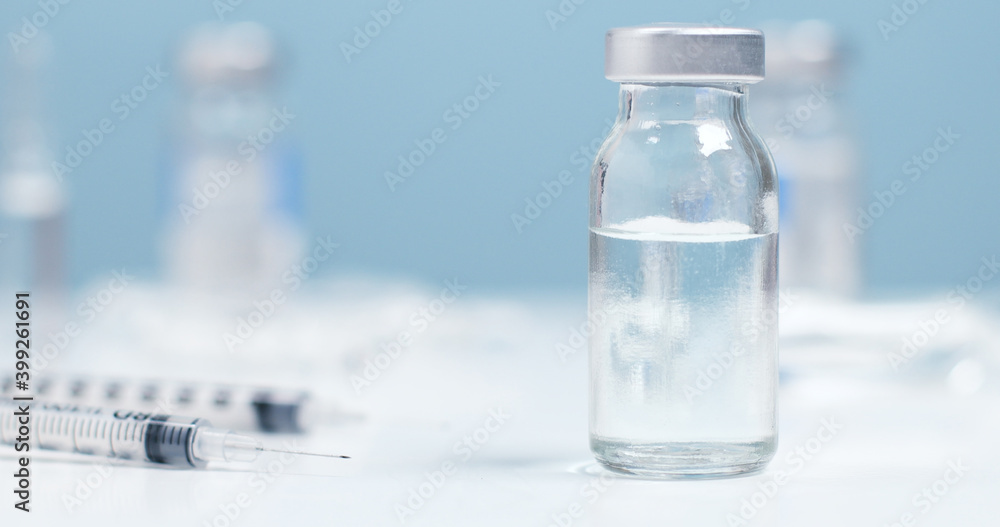 Medicines, needle syringe drug, medical Vaccine vial on a white background with copyspace. Vaccination and health care concept Medicines, needle syringe drug, medical Vaccine vial on a white background with copyspace. Vaccination and health care concept