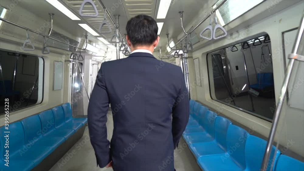 The male passenger businessman walked inside the train The male passenger businessman walked inside the train