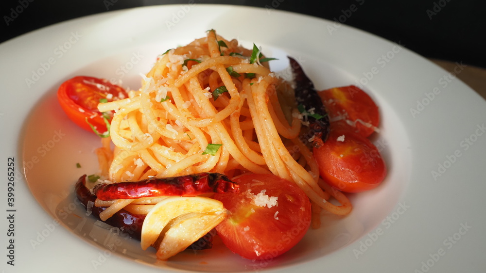 pasta cooking with tomato sauce and chili and garlic,OLYMPUS DIGITAL CAMERA pasta cooking with tomato sauce and chili and garlic,OLYMPUS DIGITAL CAMERA