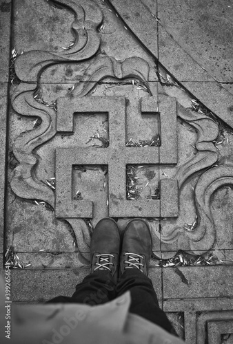 Fotografie swastika sign on pedestrian tiles. Over view.