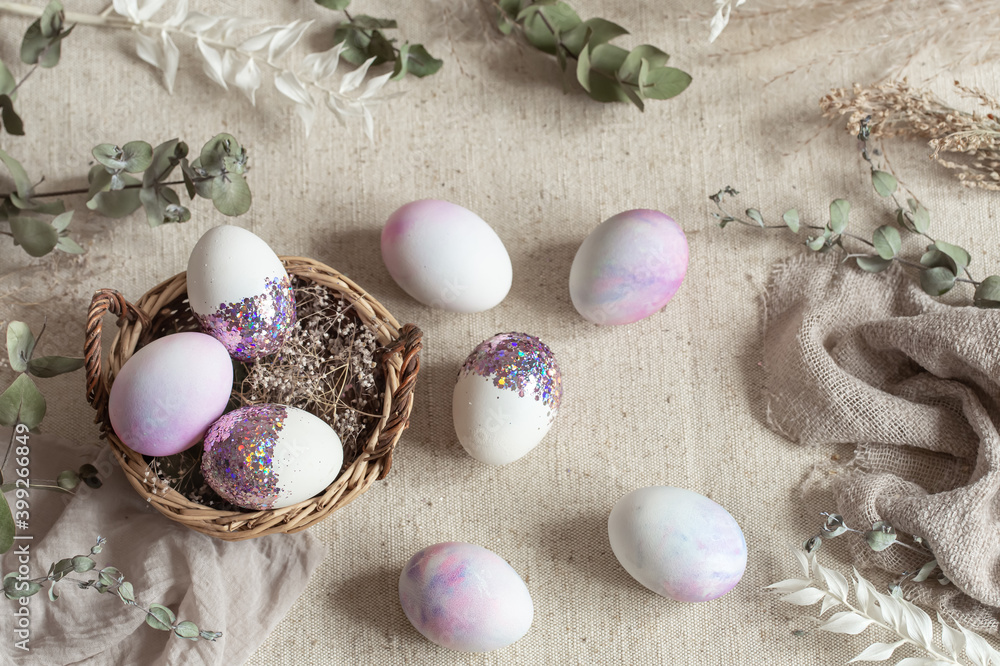 Easter composition with decorative eggs in a basket on sackcloth. Easter composition with decorative eggs in a basket on sackcloth.