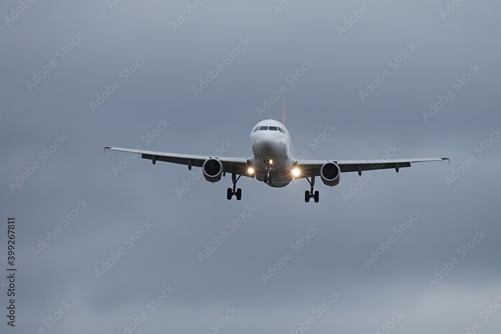 Plane approaching with landing lights