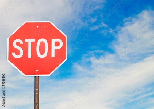 Red stop sign in the road