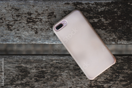 mobile phone on wooden surface