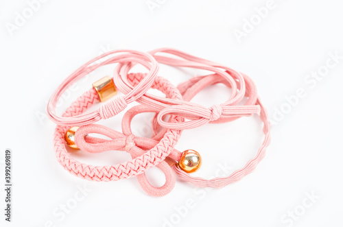 Set of pink fabric rubber bands.