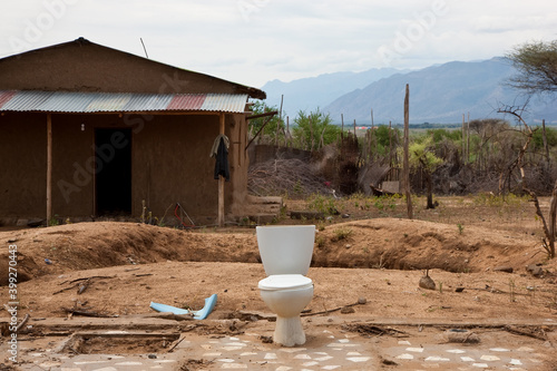 Single toilet outside a derelict shack, Ethiopia photo