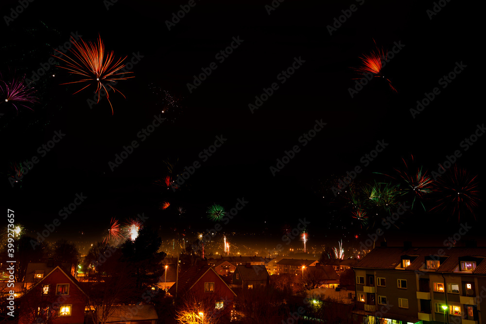 Fototapeta premium Cityscape view with fireworks on the sky