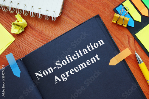 Non-Solicitation Agreement on black paper with pen.