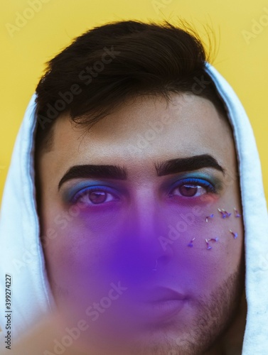 gay boy with piercing look, and modern style, flamboyant, eye-catching. Gay concept