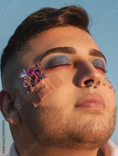 gay boy with piercing look, and modern style, flamboyant, eye-catching. Gay concept