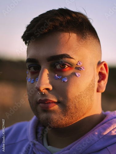gay boy with piercing look, and modern style, flamboyant, eye-catching. Gay concept