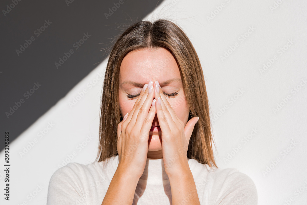 Woman feeling unwell, painful headache because of sinus ache, sinusitis
