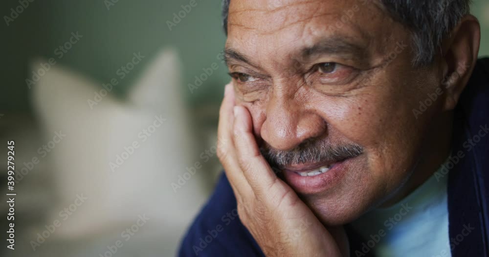 Portrait of senior mixed race man looking away smiling Portrait of senior mixed race man looking away smiling