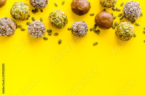 Raw energy balls with coconut and pumpkin seeds  top view