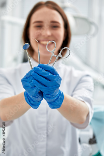 Fototapeta Naklejka Na Ścianę i Meble -  Close-up of dentist's hands and dental equipment