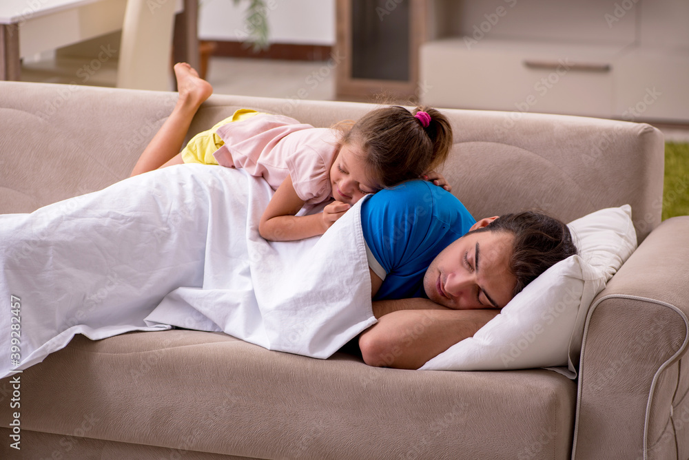 Young man with his daughter at home