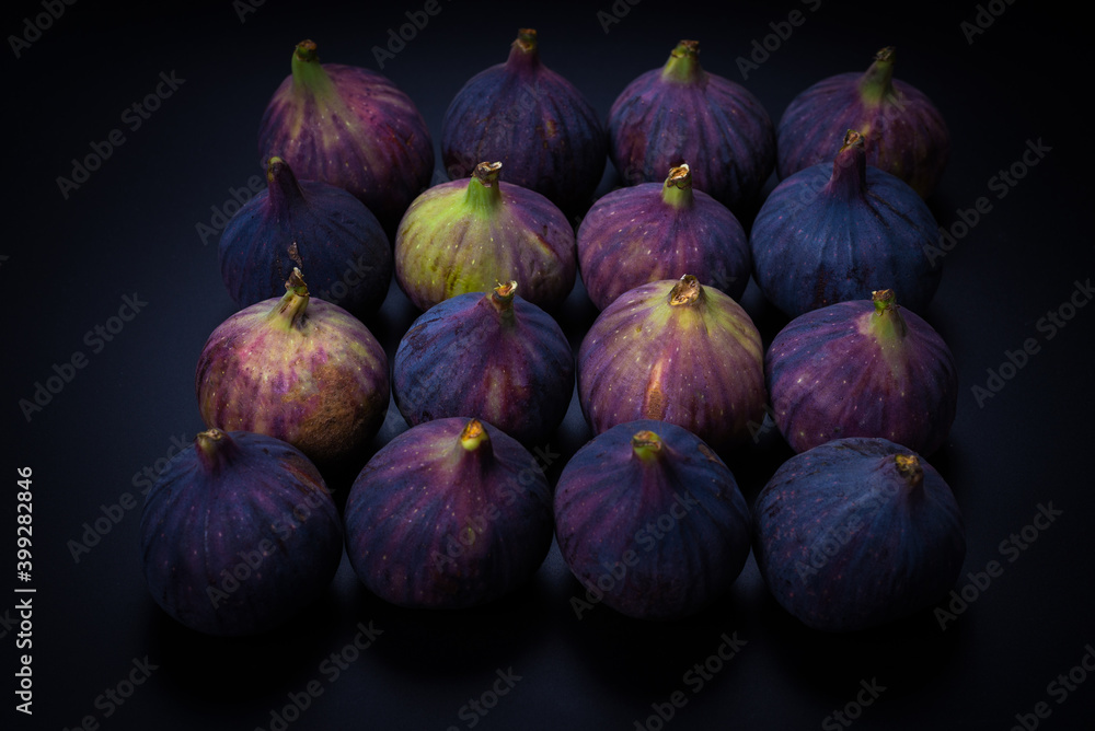 Tasty figs on a black background. Top view. Tasty figs on a black background. Top view.