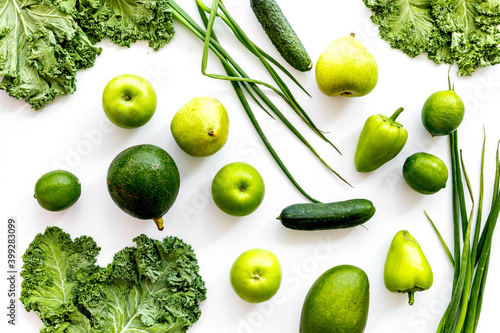 Green vegetables and fruits background. Vegetarians meal, top view