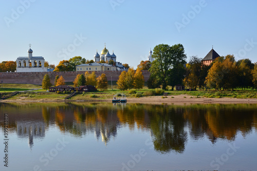 Autumn view of the Novgorod Kremlin with reflection in the water of the Volkhov River. Veliky Novgorod. Russia. Saint Sophia Cathedral and belfry