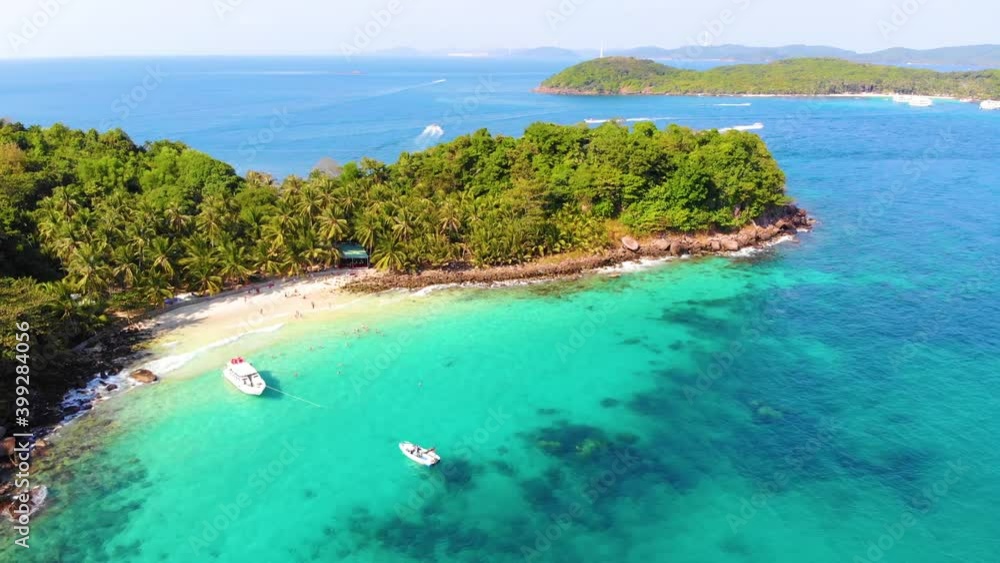 Aerial view of beautiful landscape, tourism boats, and people swimming on the sea and beach on May Rut island (a tranquil island with beautiful beach) in Phu Quoc, Kien Giang, Vietnam. Aerial view of beautiful landscape, tourism boats, and people swimming on the sea and beach on May Rut island (a tranquil island with beautiful beach) in Phu Quoc, Kien Giang, Vietnam.