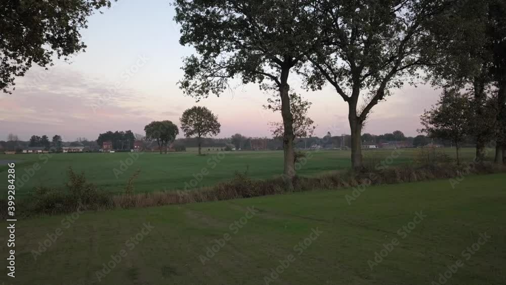 Aerial flight over a beautiful countryside sunrise or sunset landscape. High quality 4k drone footage panning shot Aerial flight over a beautiful countryside sunrise or sunset landscape. High quality 4k drone footage panning shot