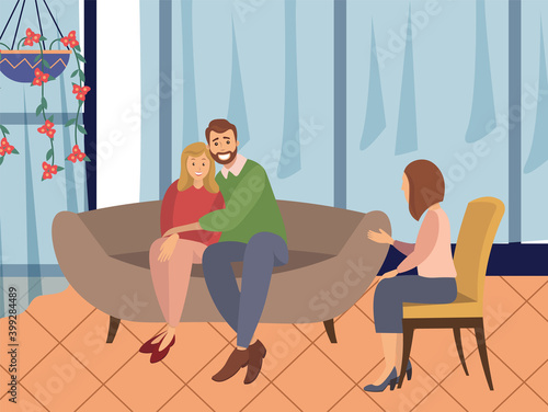 A man and a woman are sitting on a large brown sofa. The psychologist sits next to a couple and asks questions. Married couple sitting on the couch together during the happy psychotherapy session