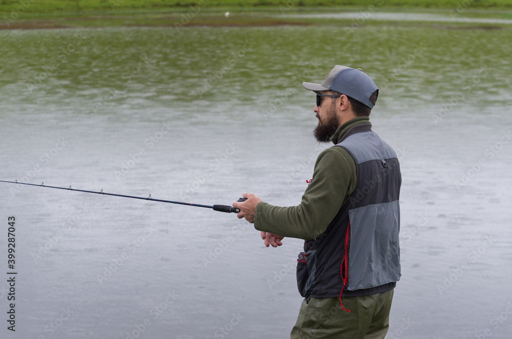Black bass fisherman fishing inside lake Black bass fisherman fishing inside lake