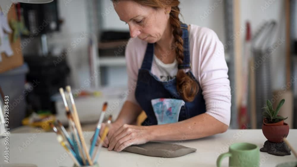Woman at work in ceramic pottery creative studio - Handmade handcraft artist Woman at work in ceramic pottery creative studio - Handmade handcraft artist