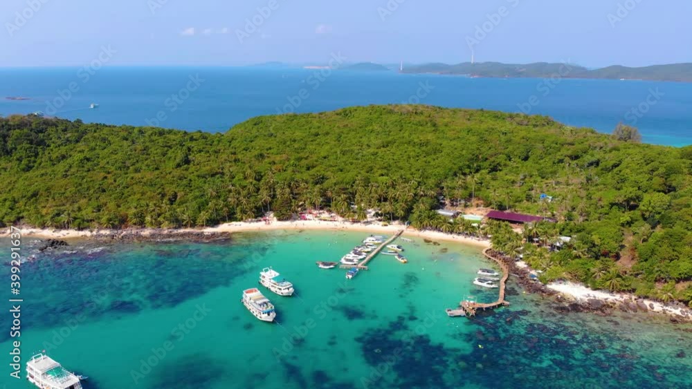Aerial view of beautiful landscape, tourism boats, and people swimming on the sea and beach on May Rut island (a tranquil island with beautiful beach) in Phu Quoc, Kien Giang, Vietnam. Aerial view of beautiful landscape, tourism boats, and people swimming on the sea and beach on May Rut island (a tranquil island with beautiful beach) in Phu Quoc, Kien Giang, Vietnam.