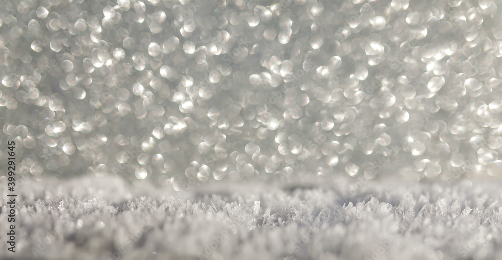 Obraz premium holiday background with white snow crystals and glittering silver sparks and circles