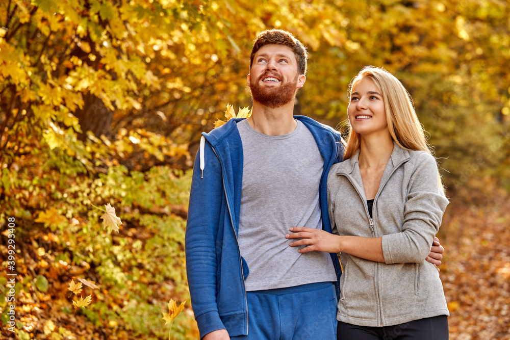 good-looking young caucasian family in the autumn nature, stand in casual sportive wear contemplate the nature and animals around, smile good-looking young caucasian family in the autumn nature, stand in casual sportive wear contemplate the nature and animals around, smile