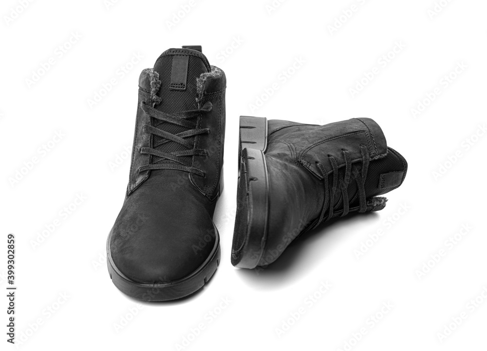Winter shoes isolated on white background. Winter black boots. Winter shoes isolated on white background. Winter black boots.