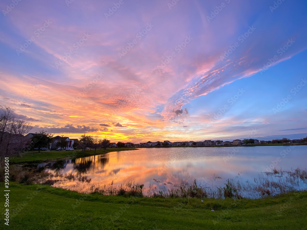 Beautiful pink, orange and blue sunset reflecting on a lake Beautiful pink, orange and blue sunset reflecting on a lake