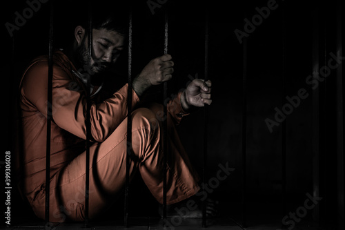 Asian man desperate at the iron prison,prisoner concept,thailand people,Hope to be free,Serious prisoners imprisoned in the prison