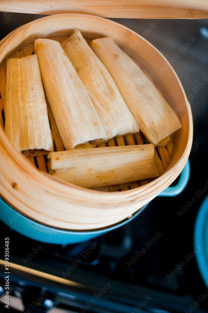 Tamales. Classic méso-américain or Mexican cuisine. Seasoned Meats wrapped in masa dough and steamed in corn husks or banana leaves. Traditional regional cuisine.