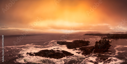 Ucluelet, Vancouver Island, British Columbia, Canada. Aerial Panoramic View of a Small Town near Tofino on a Rocky Pacific Ocean Coast. cloudy and colorful sunset sky.