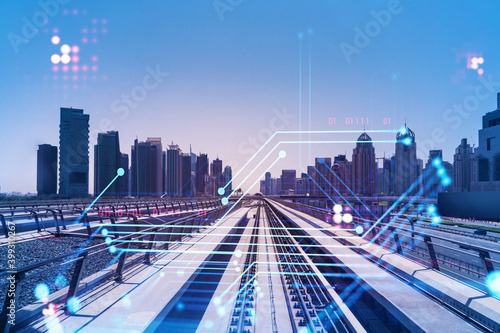 The way towards skyscrapers by modern futuristic train. Tech railway delivers commuters to the financial downtown of Dubai. Transportation tech railroad concept. Double exposure