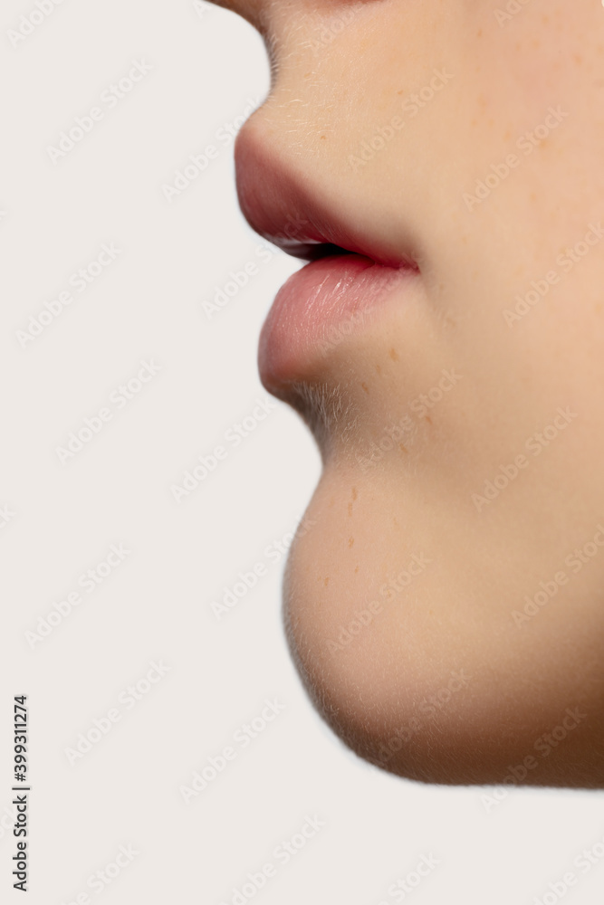Profile lips. Close up portrait of beautiful redhair caucasian female model. Parts of face. Beauty, fashion, skincare, cosmetics, wellness concept. Copyspace. Well-kept skin, fresh look, details. Profile lips. Close up portrait of beautiful redhair caucasian female model. Parts of face. Beauty, fashion, skincare, cosmetics, wellness concept. Copyspace. Well-kept skin, fresh look, details.