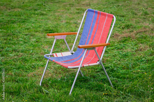 Deck-chair on grass. Lawn chairs in the park Empty Park.