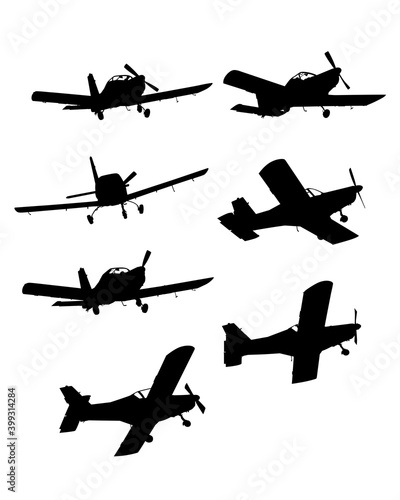 Light single-engine plane flies across the sky. Isolated object on white background