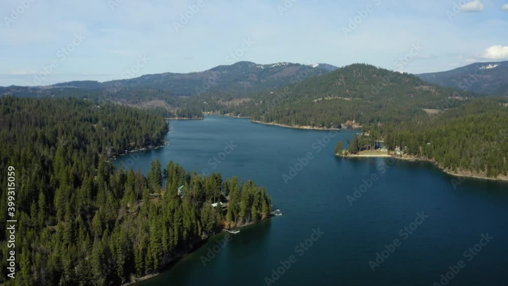 Scenic aerial drone of Hayden Lake Idaho with trees and mountains Scenic aerial drone of Hayden Lake Idaho with trees and mountains