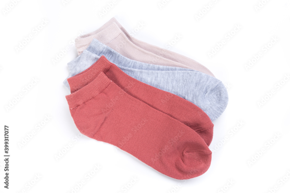 several pairs of short socks on a white background, top view several pairs of short socks on a white background, top view