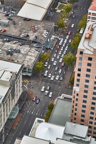 Urban road intersection with passing cars