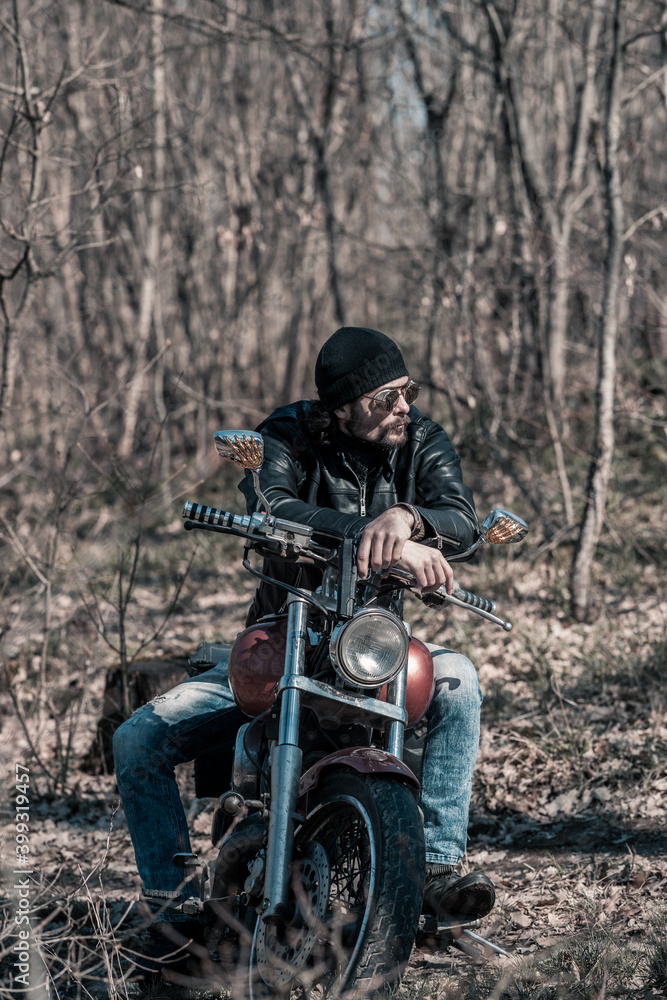 Biker portrait. Photo with a motorcycle